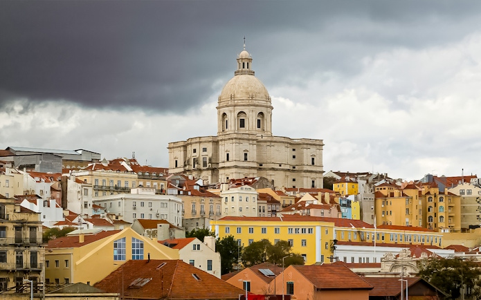 National Pantheon in Lisbon with colorful surrounding buildings.