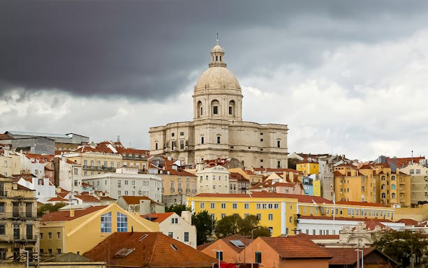 National Pantheon in Lisbon with colorful surrounding buildings.