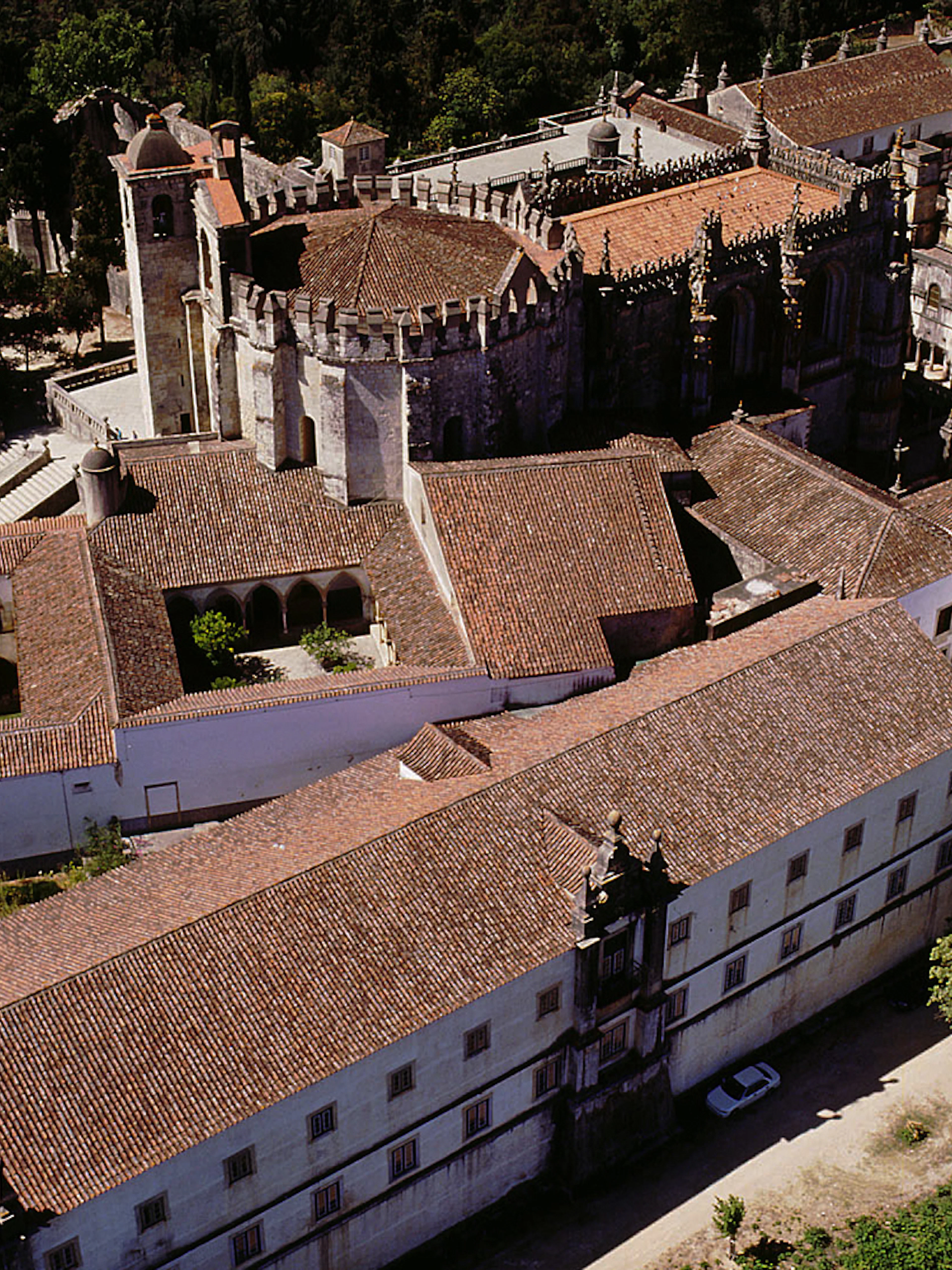 Aerial view of the Convent of Christ in Lisbon, showcasing its historic architecture and surrounding gardens.