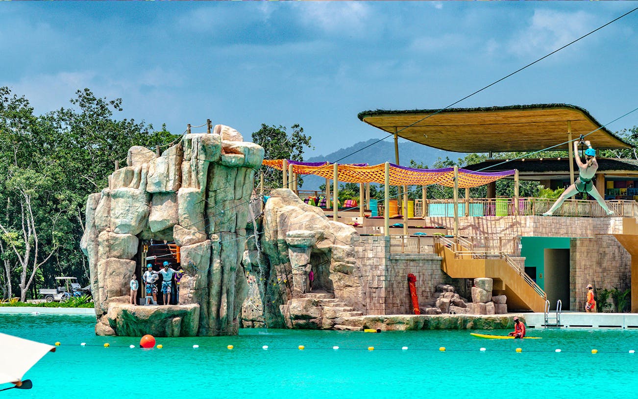 Zipline over pool at Blue Tree Water Park, Thailand.