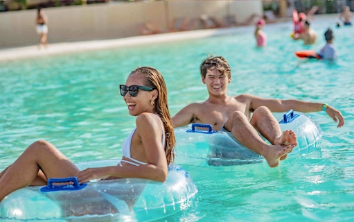 Floating on tubes at Blue Tree Water Park, Thailand.