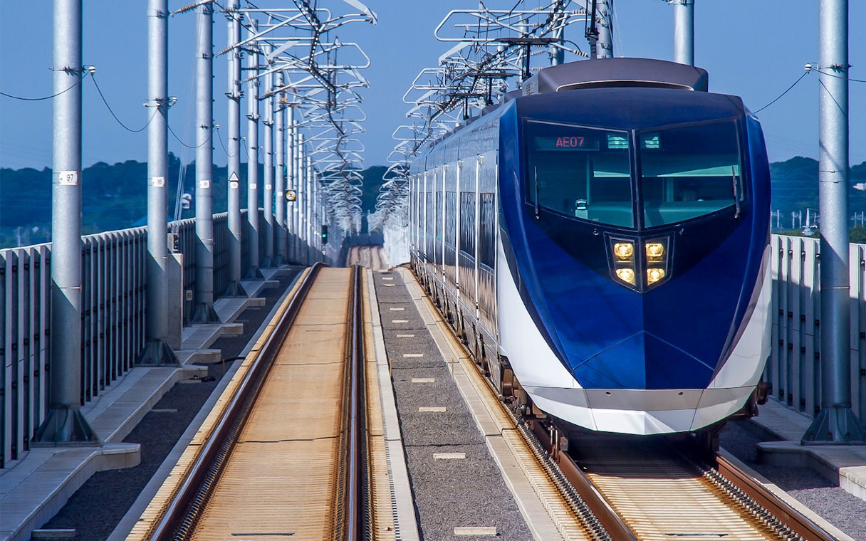 Skyliner train on elevated tracks in Tokyo, Japan.