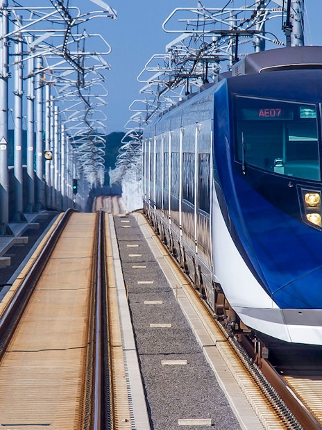 Skyliner train on elevated tracks in Tokyo, Japan.