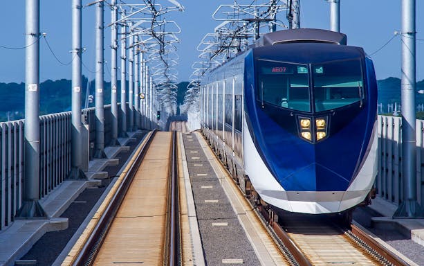 Skyliner train on elevated tracks in Tokyo, Japan.