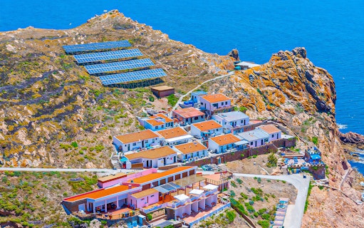 Berlenga Grande Island village with solar panels and ocean view, Portugal.