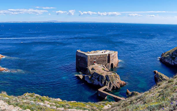 Berlenga Grande Island fort surrounded by blue ocean, part of Lisbon boat tour.