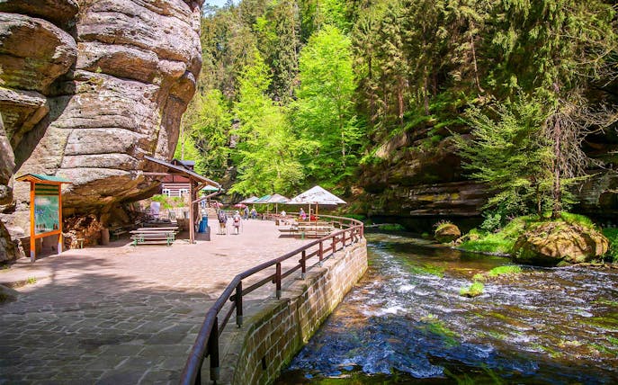 Guided tour path along river in Bohemian Switzerland National Park.