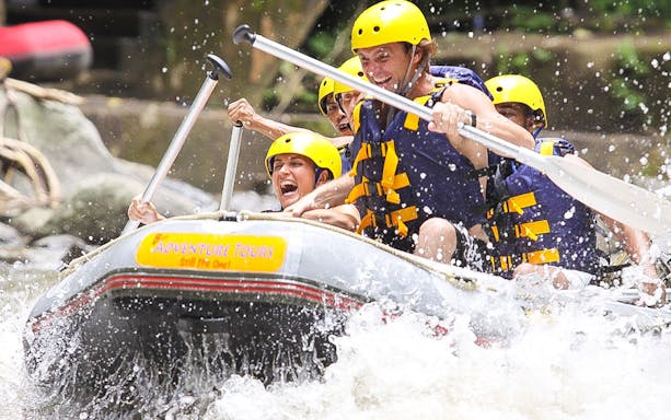 White water rafting on Ayung River with Mason Adventures, group paddling through rapids.