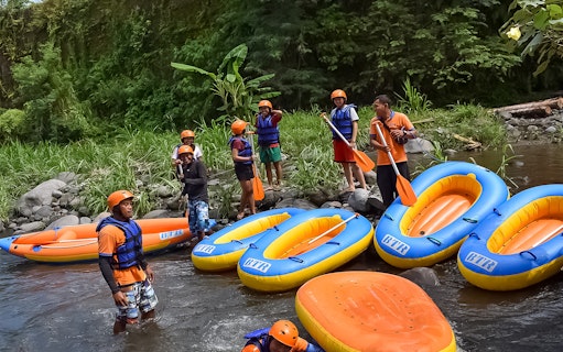 White water rafting group preparing on Telaga Waja River with BTR rafts.