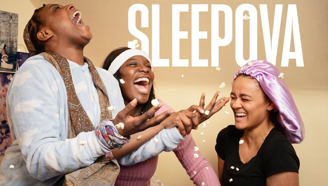 People laughing and throwing popcorn during a sleepover, Sleepova theme.