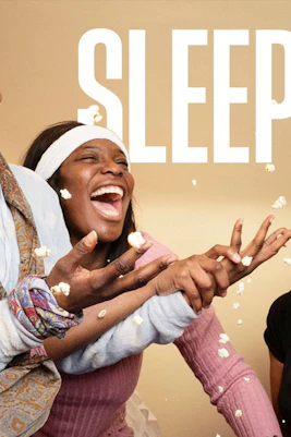 People laughing and throwing popcorn during a sleepover, Sleepova theme.