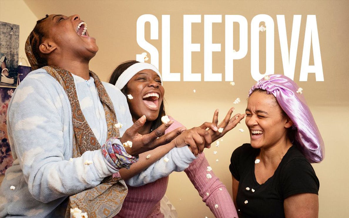 People laughing and throwing popcorn during a sleepover, Sleepova theme.