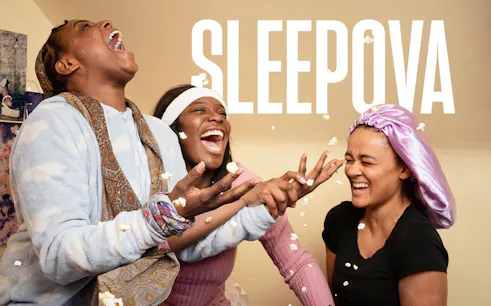 People laughing and throwing popcorn during a sleepover, Sleepova theme.