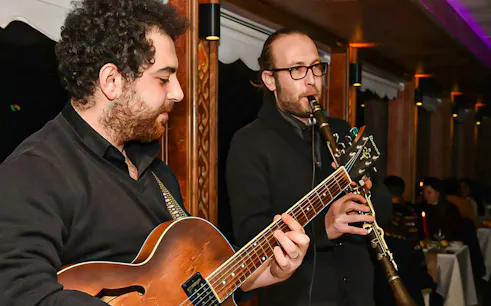 Musicians playing guitar and clarinet on a Bosphorus dinner cruise, Istanbul.