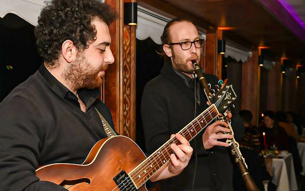Musicians playing guitar and clarinet on a Bosphorus dinner cruise, Istanbul.