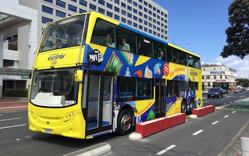 Auckland Explorer Bus on city street near SEA LIFE Kelly Tarlton's, New Zealand.