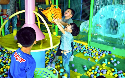 Children playing in ball pit at Jungle Gym, Kuala Lumpur.