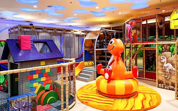 Indoor play area at Jungle Gym, Kuala Lumpur with slides and colorful structures.