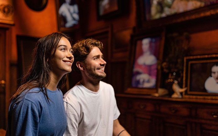 Visitors enjoying art at Rembrandts Amsterdam Experience.