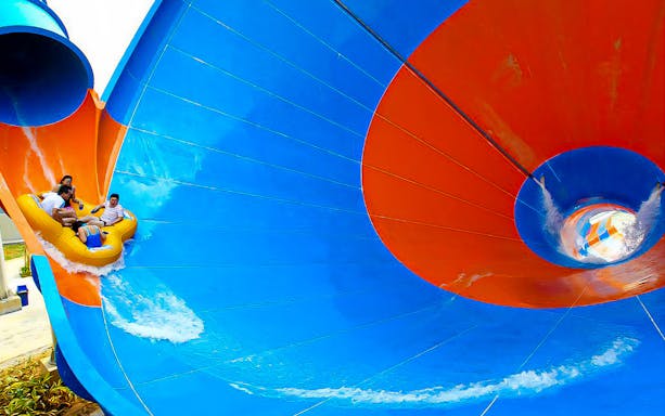 Visitors on a water slide at I-City Theme Park.