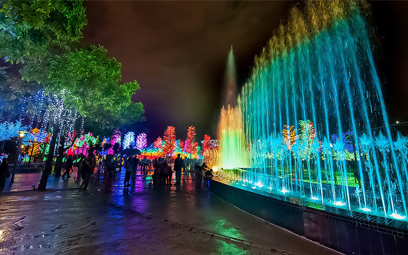 Colorful light display and fountain at night in I-City Theme Park, Malaysia.