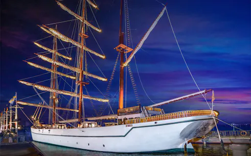 Sirimahannop ship docked at Asiatique The Riverfront during evening dinner cruise.