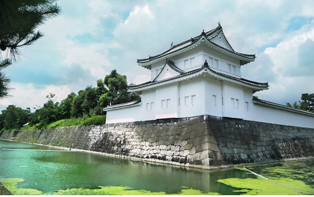 Nijo Castle's stone walls and moat in Kyoto, Japan.