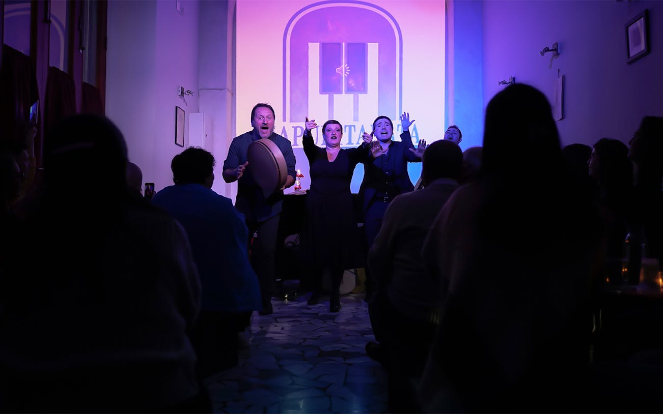 Performers at a traditional Neapolitan music concert in Naples, Italy.