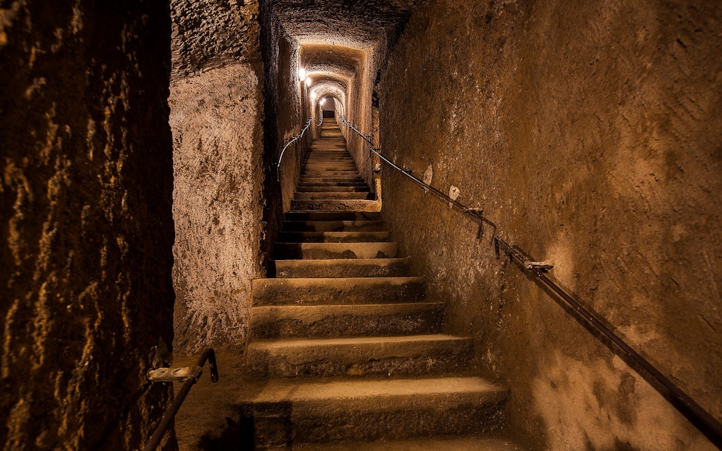 Staircase inside the Bourbon Tunnel during a guided tour in Naples, Italy.