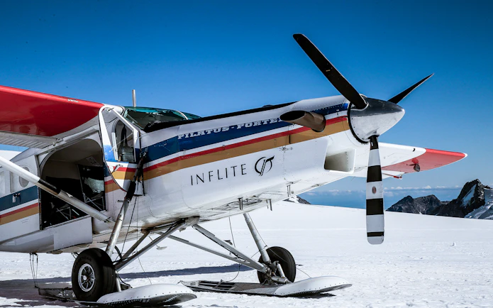 Ski plane on snowy Southern Alps runway for 1-hour aerial tour.