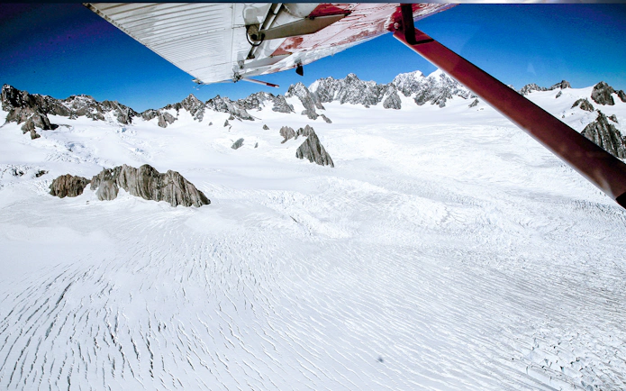 Aerial view of Southern Alps snowfields from a ski plane during a 1-hour tour.