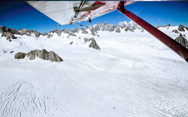 Aerial view of Southern Alps snowfields from a ski plane during a 1-hour tour.