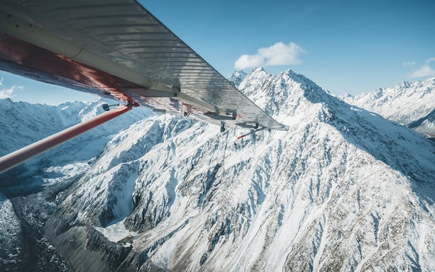 Aerial view of snow-covered mountains from a ski plane during a 45-minute glacier flight.