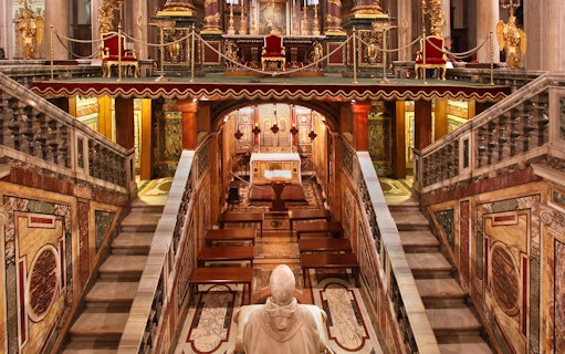 Interior view of Santa Maria Maggiore Basilica altar and ornate architecture.
