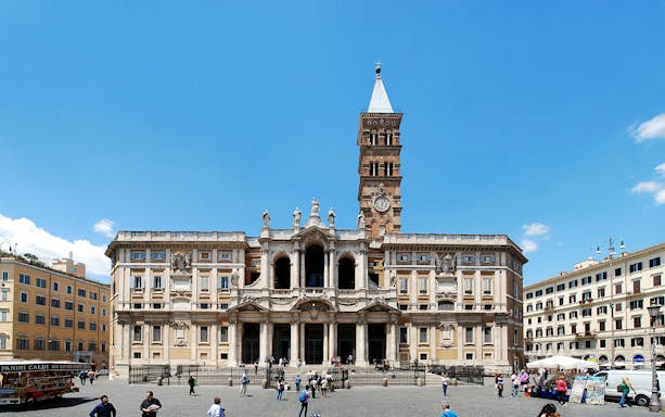 Santa Maria Maggiore Basilica facade with visitors in Rome, Italy.
