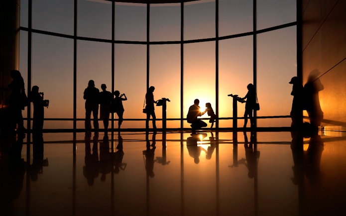 Visitors enjoying sunset views from Burj Khalifa's Level 124 and 125 observation deck.