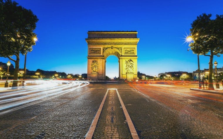 Arc de Triomphe illuminated at night, Paris, France.