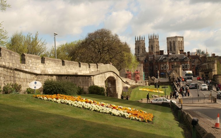 York city walls with York Minster in the background, seen on a day trip by rail.