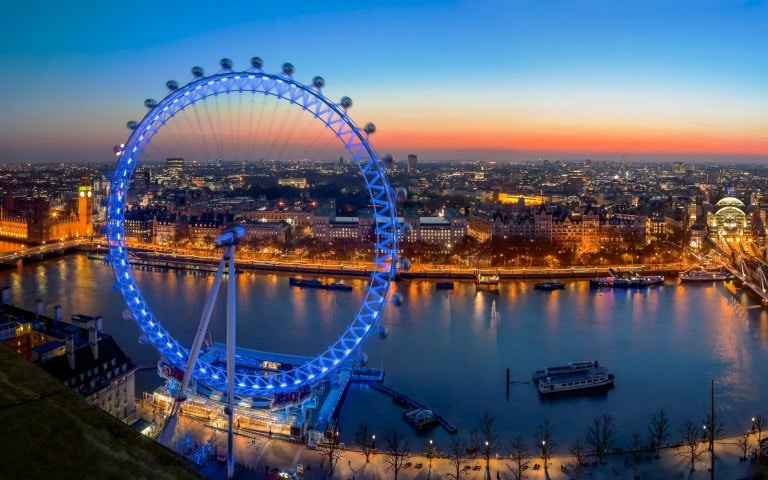 London Eye with panoramic view of Thames River and The Monument in London.