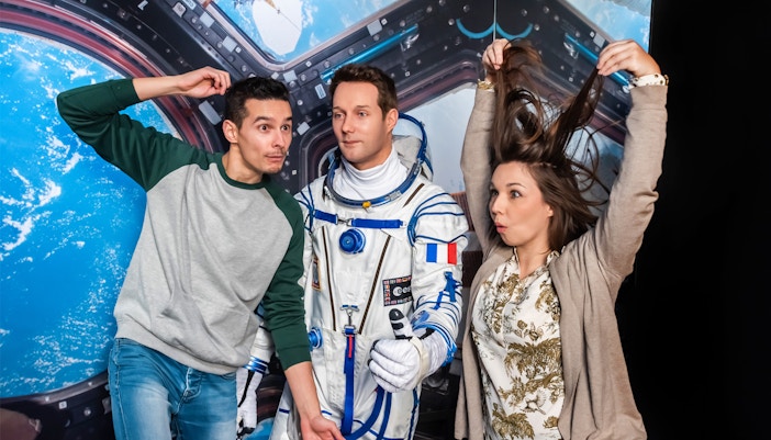 Grevin Wax Museum Paris, visitors viewing wax figures of historical and cultural icons.