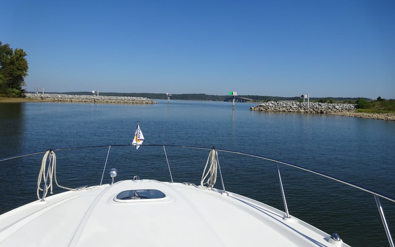 Boat cruising through marina channel during early evening dinner cruise.