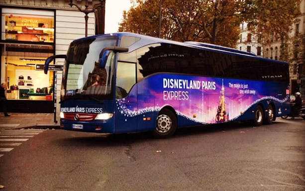 Disneyland Paris Express luxury coach parked in Paris street.