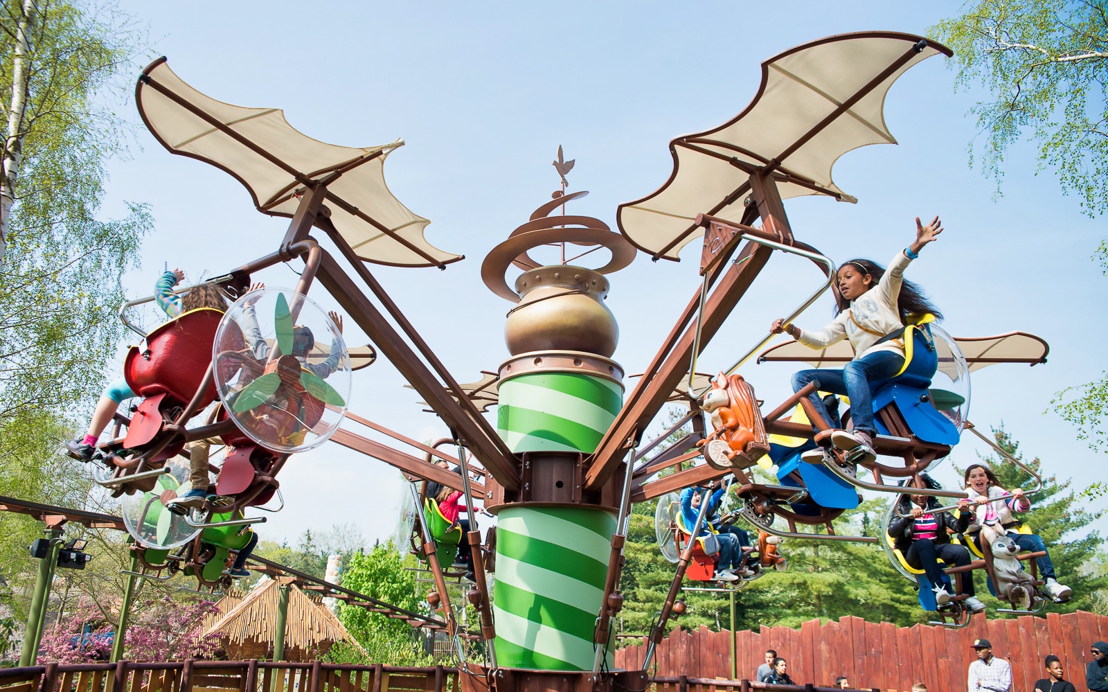 Visitors experiencing rides at Astérix Park, Paris, with full-day tickets.