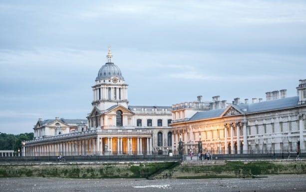 Old Royal Naval College viewed from the Thames during a jazz cruise in London.