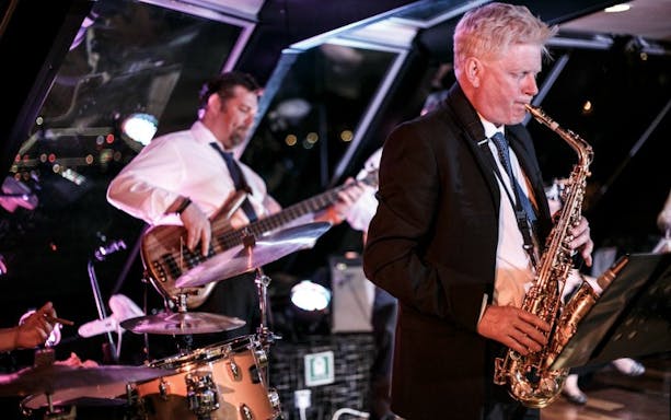 Jazz band performing on Thames River cruise.