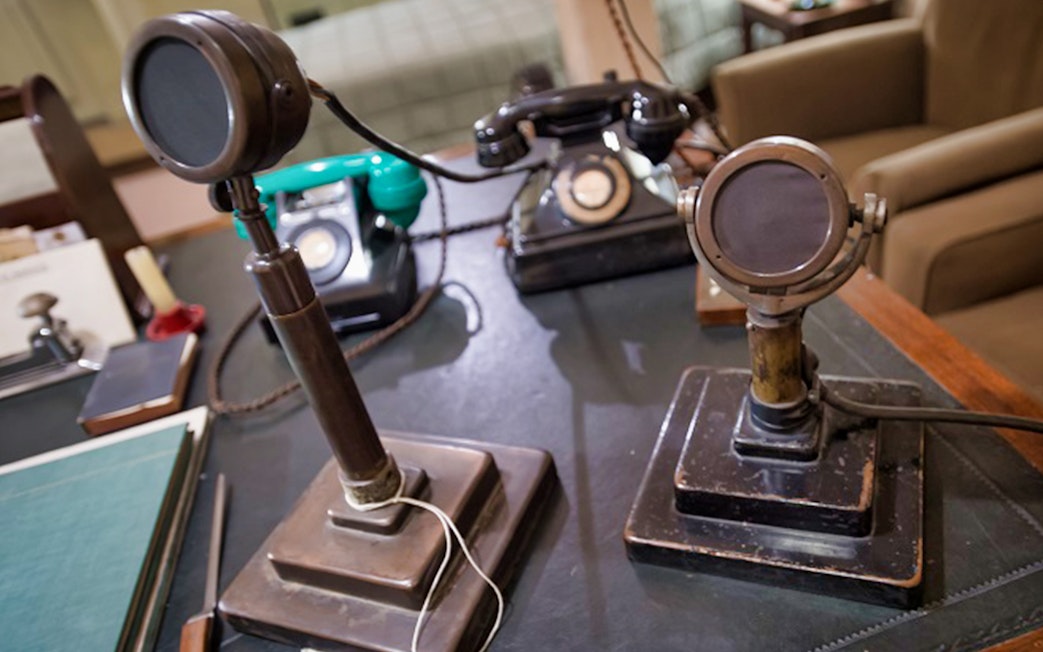 Vintage microphones and telephones in Churchill War Rooms, London.