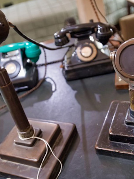Vintage microphones and telephones in Churchill War Rooms, London.