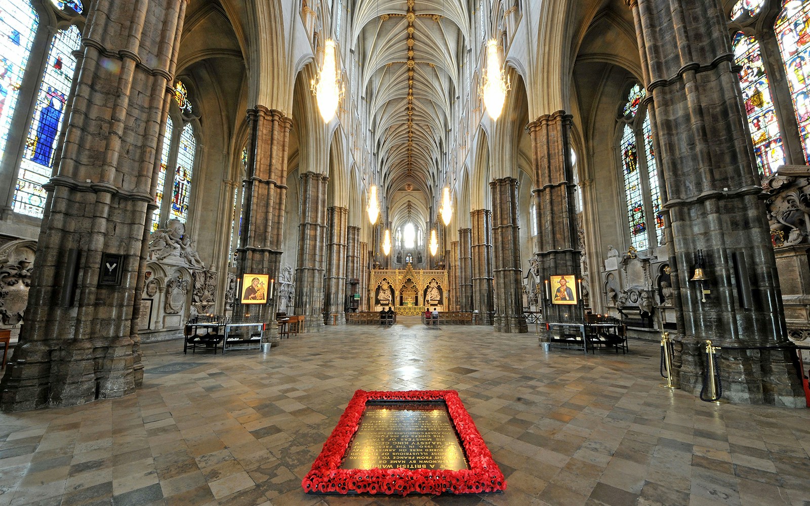 Westminster Abbey interior with ornate arches and stained glass windows, London.