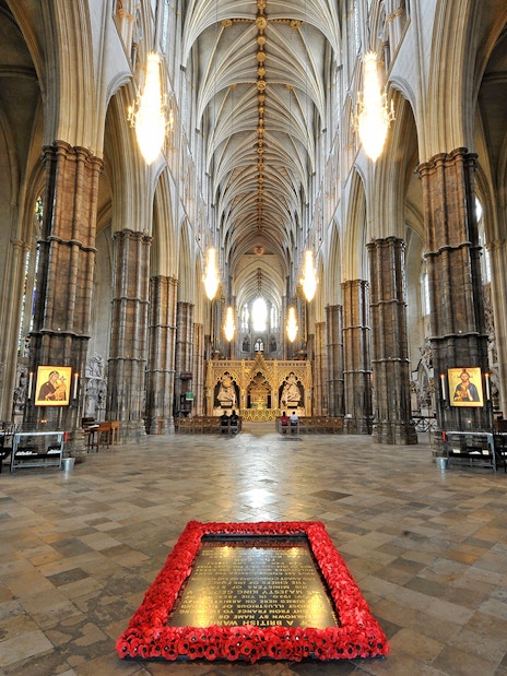 Westminster Abbey interior with ornate arches and stained glass windows, London.