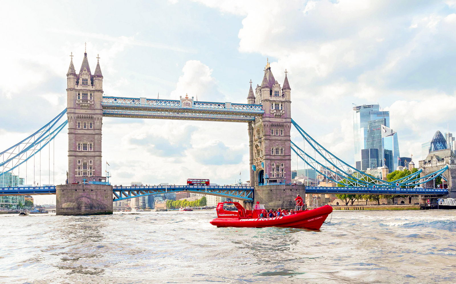 Thames Rockets speedboat passing under Tower Bridge in London.